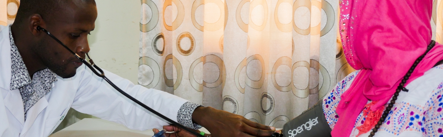 Health service provider with a client in Zimbabwe